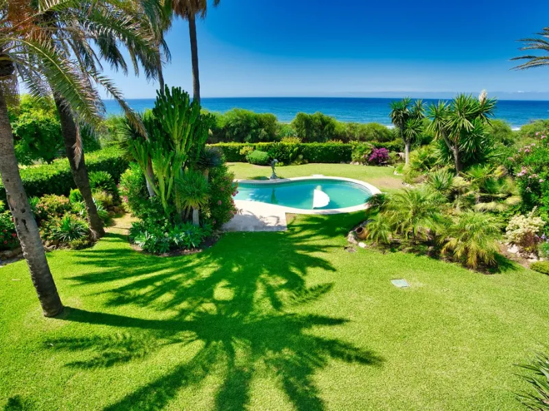 This remarkable beachfront villa, located adjacent to the renowned Nikki Beach in Elviria, East Marbella, offers an unparalleled living experience. Spread across two levels, the villa features four spacious bedrooms, each with its own en-suite bathroom, a
