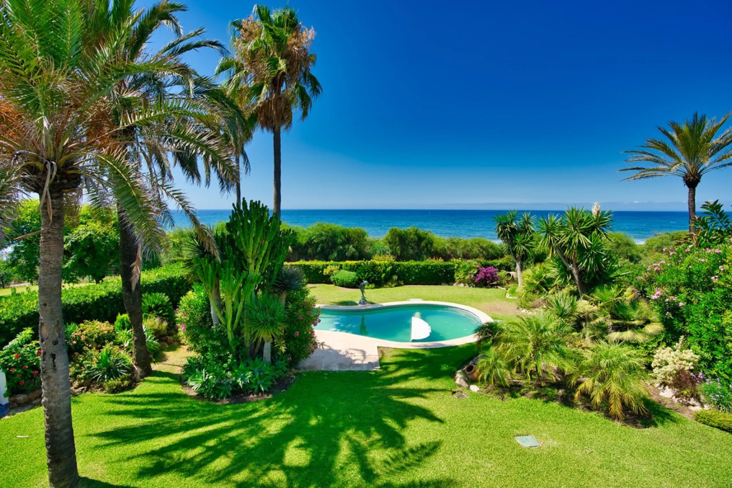 This remarkable beachfront villa, located adjacent to the renowned Nikki Beach in Elviria, East Marbella, offers an unparalleled living experience. Spread across two levels, the villa features four spacious bedrooms, each with its own en-suite bathroom, a