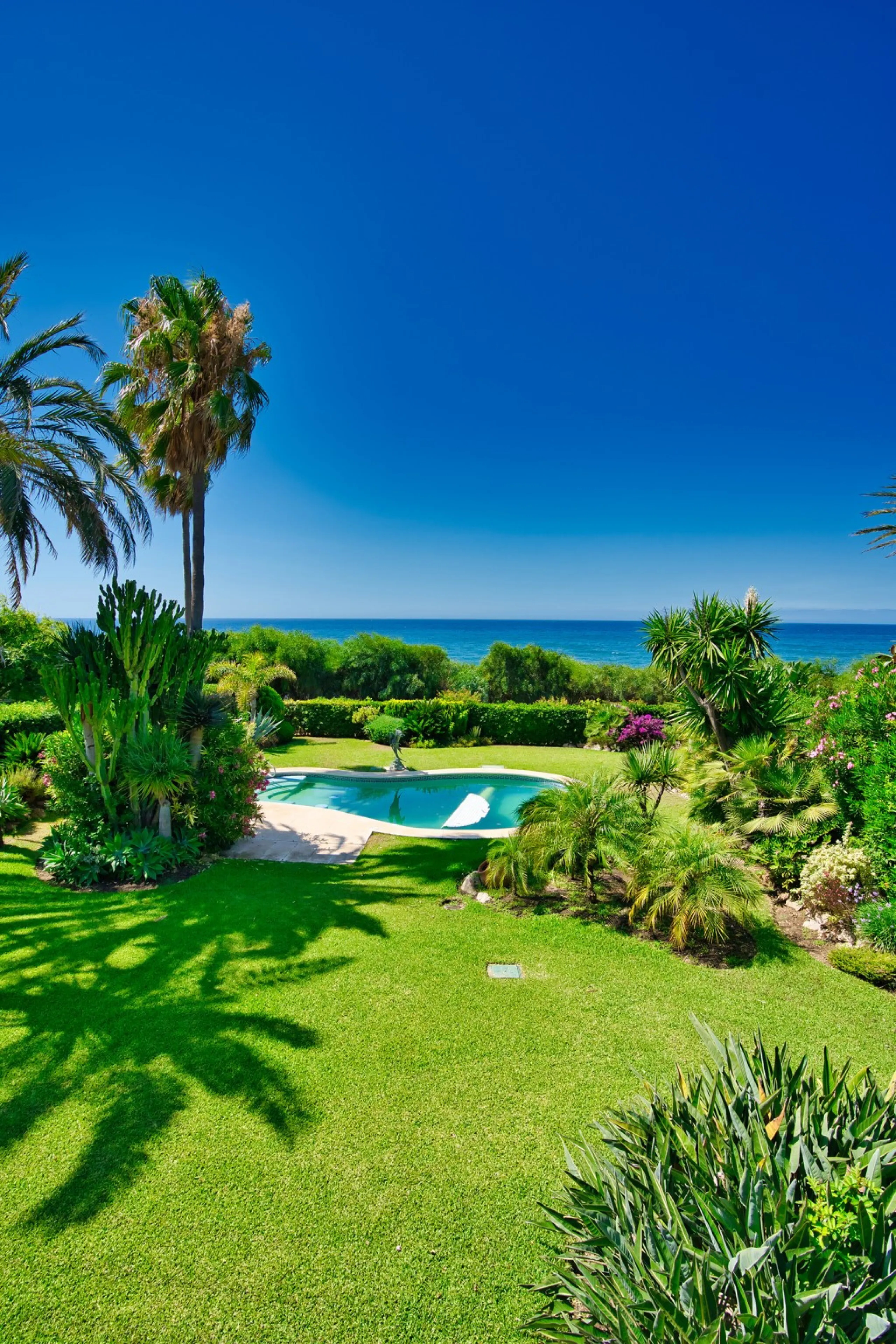 This remarkable beachfront villa, located adjacent to the renowned Nikki Beach in Elviria, East Marbella, offers an unparalleled living experience. Spread across two levels, the villa features four spacious bedrooms, each with its own en-suite bathroom, a