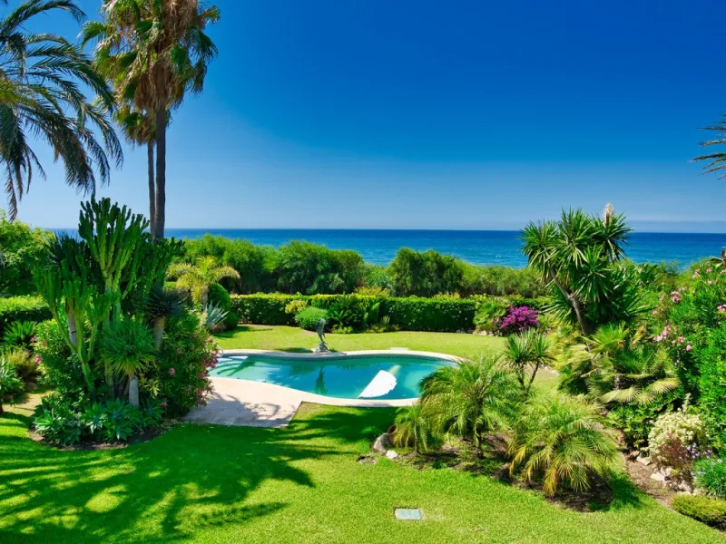 This remarkable beachfront villa, located adjacent to the renowned Nikki Beach in Elviria, East Marbella, offers an unparalleled living experience. Spread across two levels, the villa features four spacious bedrooms, each with its own en-suite bathroom, a