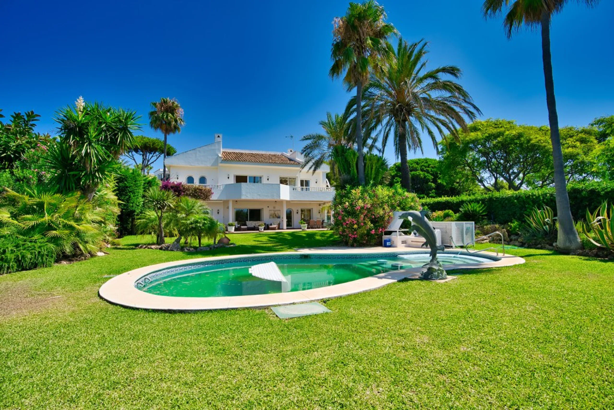 This remarkable beachfront villa, located adjacent to the renowned Nikki Beach in Elviria, East Marbella, offers an unparalleled living experience. Spread across two levels, the villa features four spacious bedrooms, each with its own en-suite bathroom, a