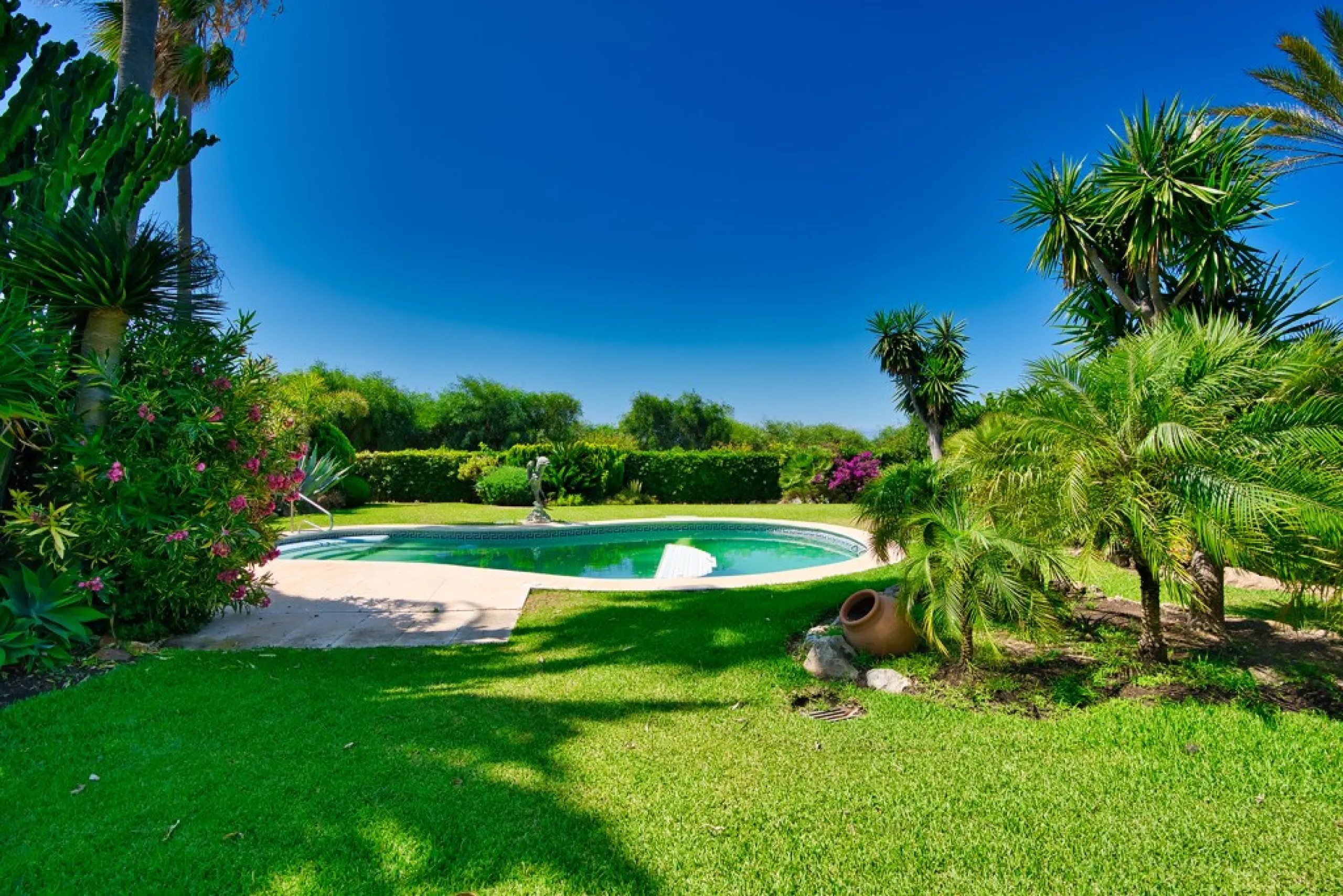 This remarkable beachfront villa, located adjacent to the renowned Nikki Beach in Elviria, East Marbella, offers an unparalleled living experience. Spread across two levels, the villa features four spacious bedrooms, each with its own en-suite bathroom, a