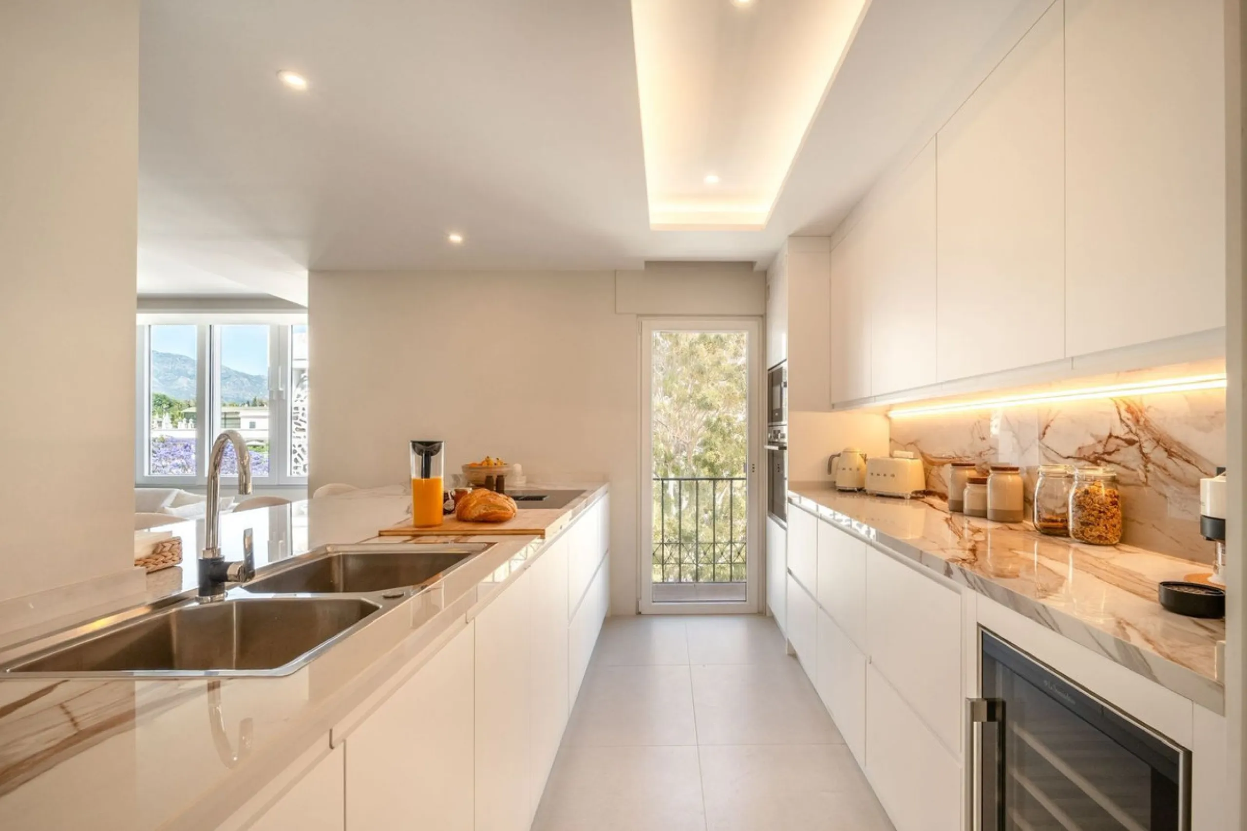 Experience luxurious living in this stunning newly refurbished penthouse, located in the prime area of Marbella Nueva Andalucía, just a short walk to Puerto Banús. This sleek and modern property features four spacious bedrooms, each with its own en-suite 
