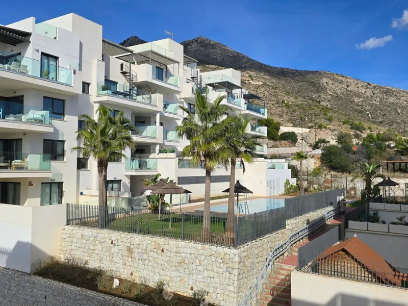 This penthouse in Benalmadena is listed at €545,000 and offers 84 m² of interior living space with two bedrooms, two bathrooms, direct access to a 71 m² total terrace area including a private rooftop solarium, plus two parking spaces and a storage room—al