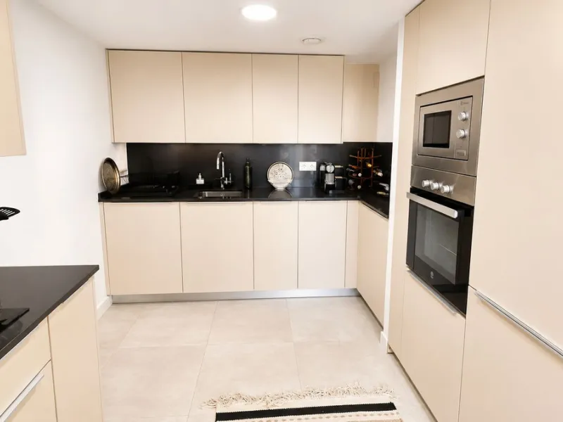 This penthouse in Benalmadena is listed at €545,000 and offers 84 m² of interior living space with two bedrooms, two bathrooms, direct access to a 71 m² total terrace area including a private rooftop solarium, plus two parking spaces and a storage room—al