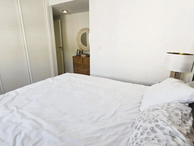 This penthouse in Benalmadena is listed at €545,000 and offers 84 m² of interior living space with two bedrooms, two bathrooms, direct access to a 71 m² total terrace area including a private rooftop solarium, plus two parking spaces and a storage room—al