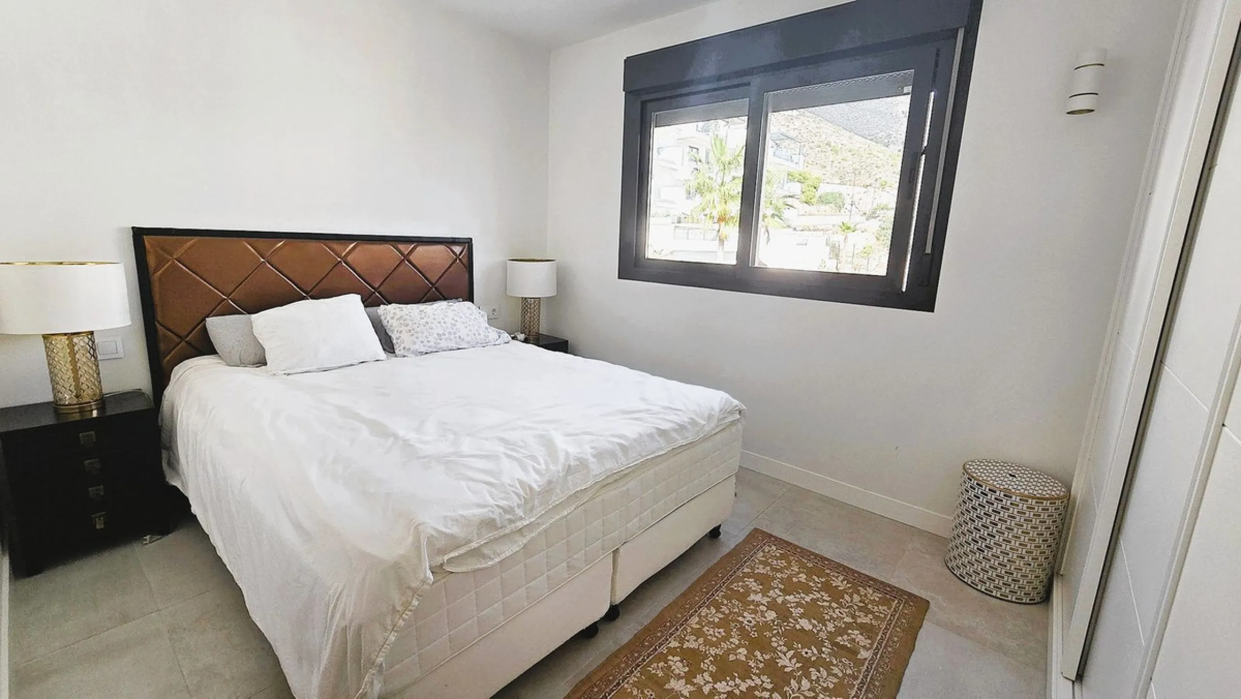 This penthouse in Benalmadena is listed at €545,000 and offers 84 m² of interior living space with two bedrooms, two bathrooms, direct access to a 71 m² total terrace area including a private rooftop solarium, plus two parking spaces and a storage room—al