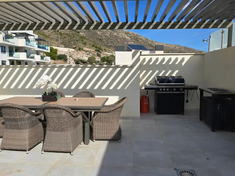 This penthouse in Benalmadena is listed at €545,000 and offers 84 m² of interior living space with two bedrooms, two bathrooms, direct access to a 71 m² total terrace area including a private rooftop solarium, plus two parking spaces and a storage room—al