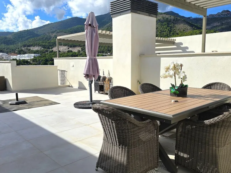 This penthouse in Benalmadena is listed at €545,000 and offers 84 m² of interior living space with two bedrooms, two bathrooms, direct access to a 71 m² total terrace area including a private rooftop solarium, plus two parking spaces and a storage room—al