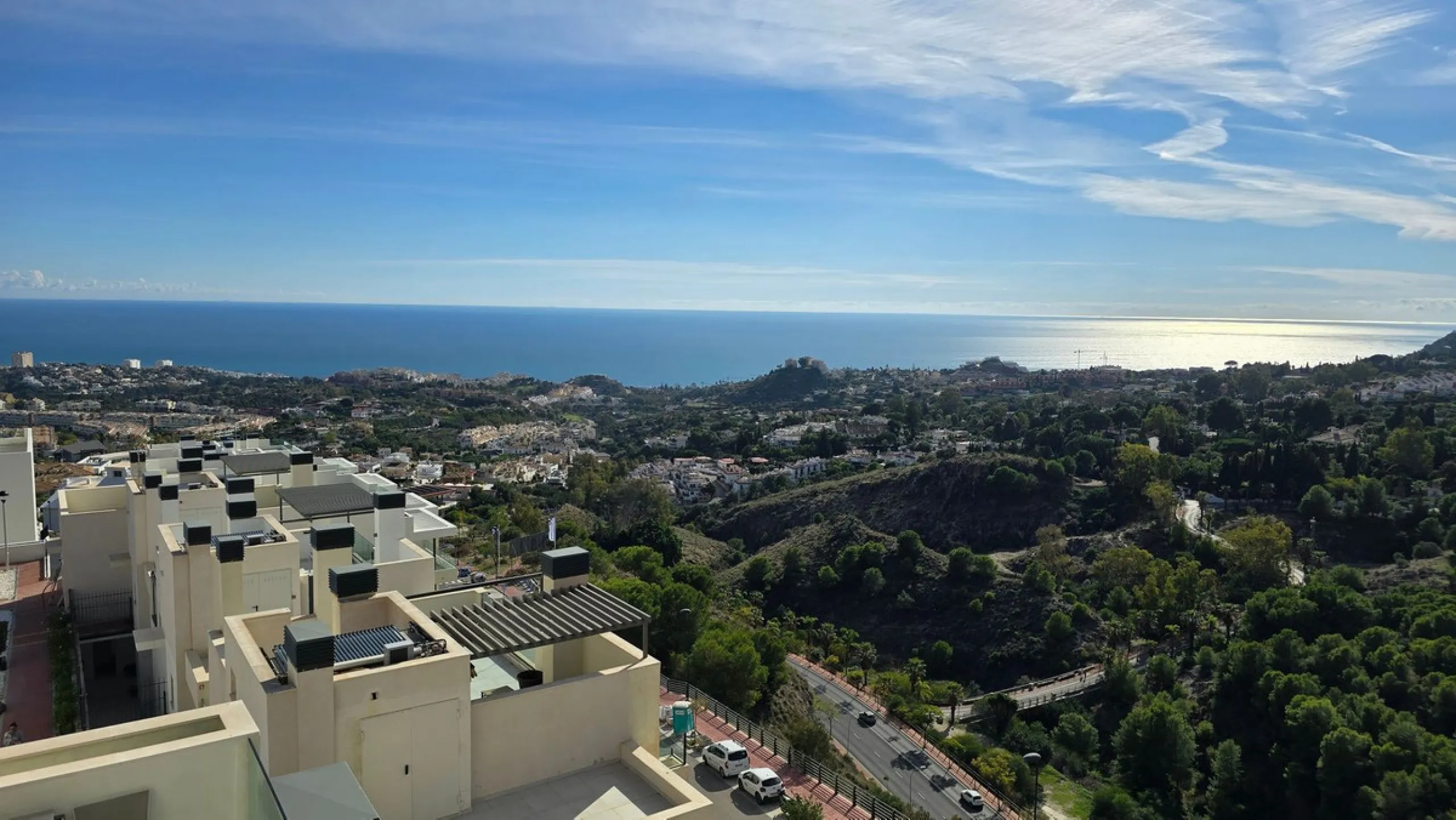 This penthouse in Benalmadena is listed at €545,000 and offers 84 m² of interior living space with two bedrooms, two bathrooms, direct access to a 71 m² total terrace area including a private rooftop solarium, plus two parking spaces and a storage room—al