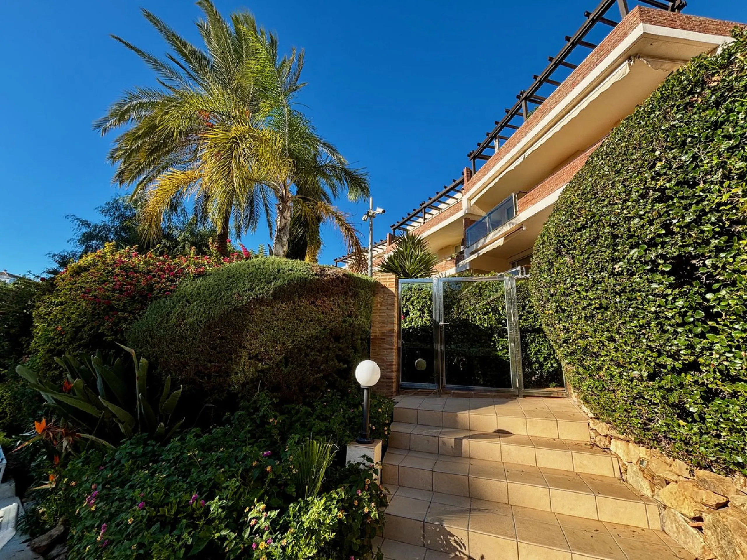 Discover this elegant 2-bedroom, 2-bathroom ground-floor apartment located in the sought-after Milenio complex in Miraflores, perfectly positioned front line to the golf course. This charming home combines comfort, style, and resort-like amenities—ideal f