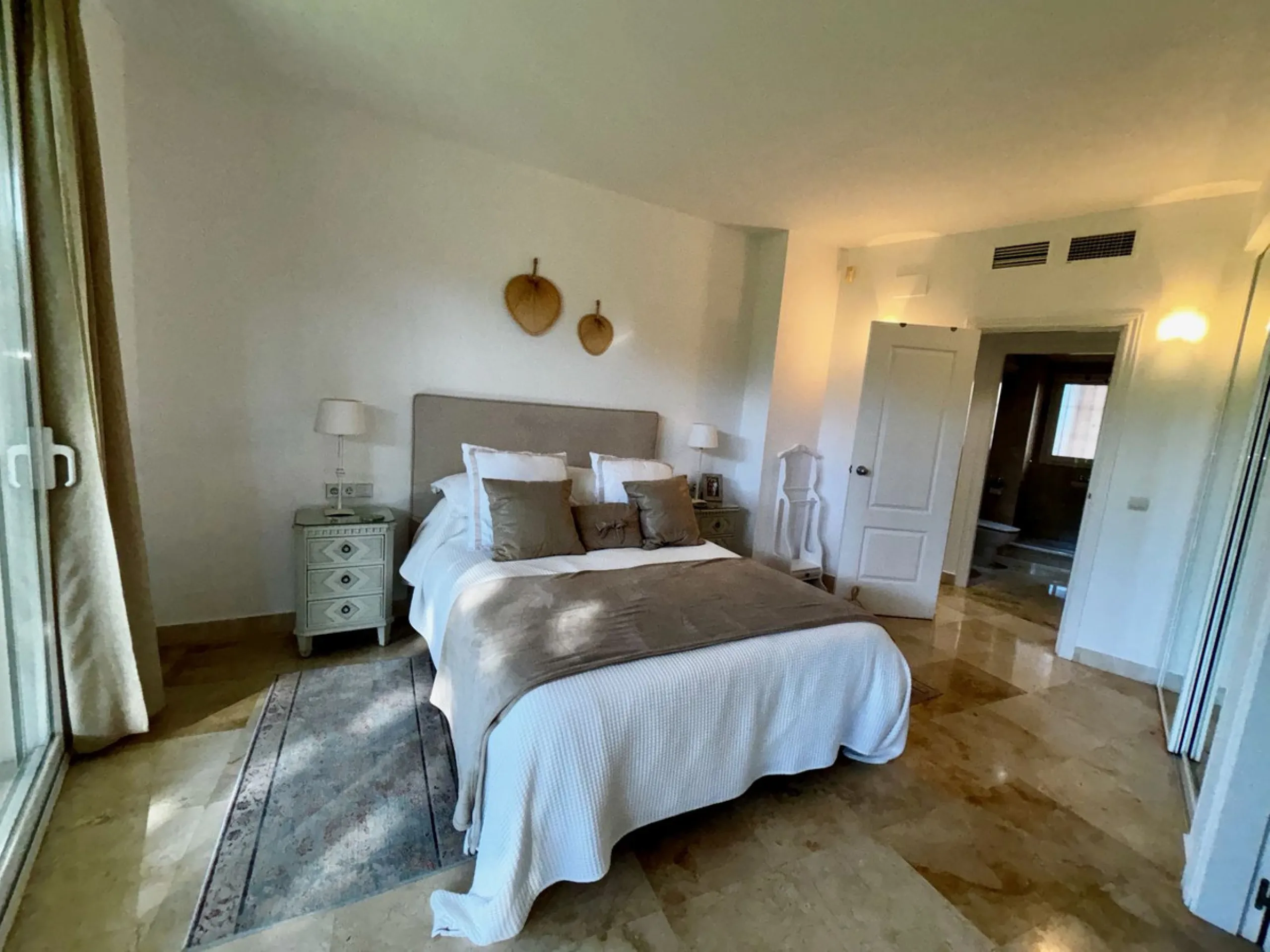 Discover this elegant 2-bedroom, 2-bathroom ground-floor apartment located in the sought-after Milenio complex in Miraflores, perfectly positioned front line to the golf course. This charming home combines comfort, style, and resort-like amenities—ideal f