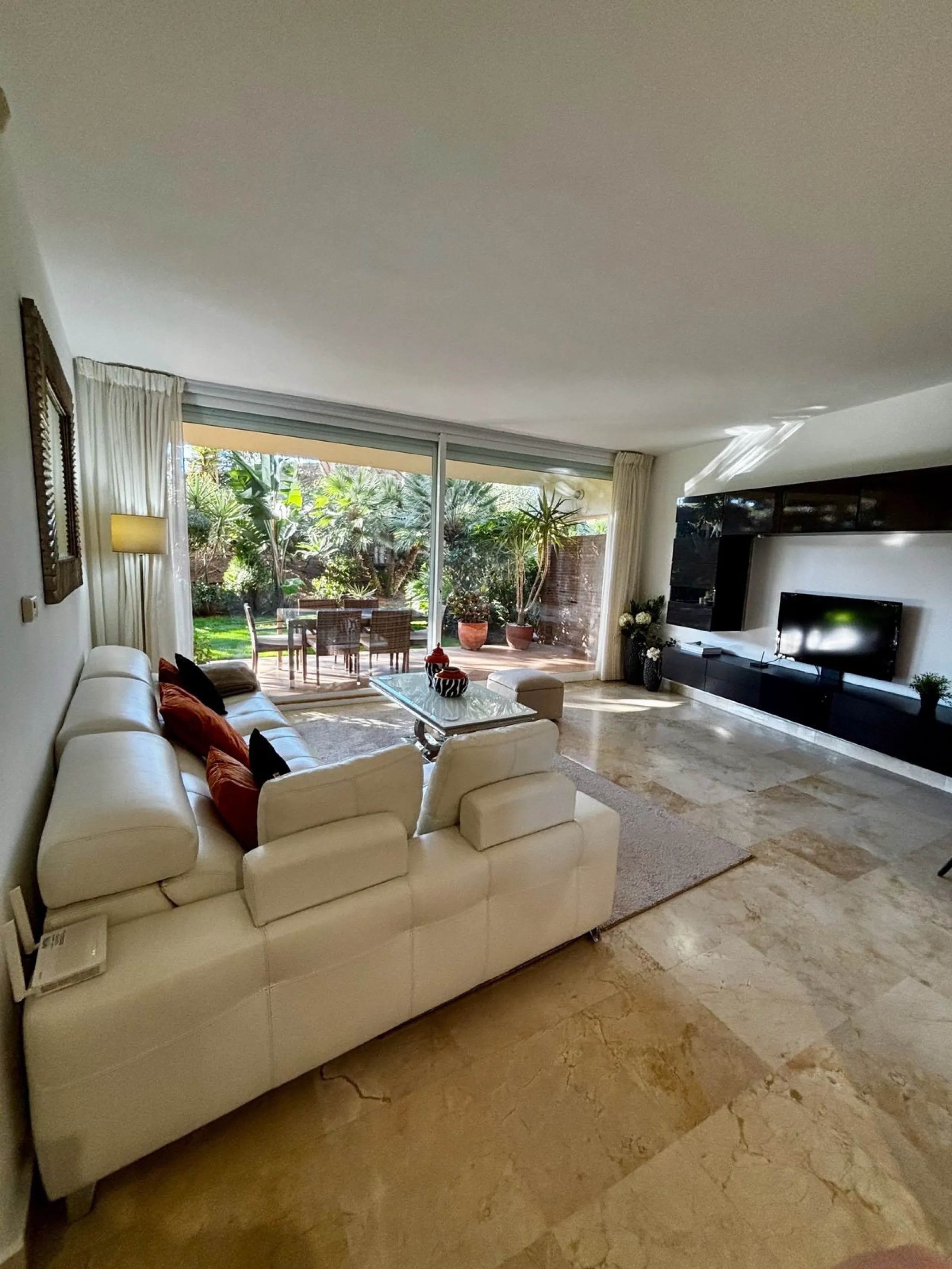 Discover this elegant 2-bedroom, 2-bathroom ground-floor apartment located in the sought-after Milenio complex in Miraflores, perfectly positioned front line to the golf course. This charming home combines comfort, style, and resort-like amenities—ideal f