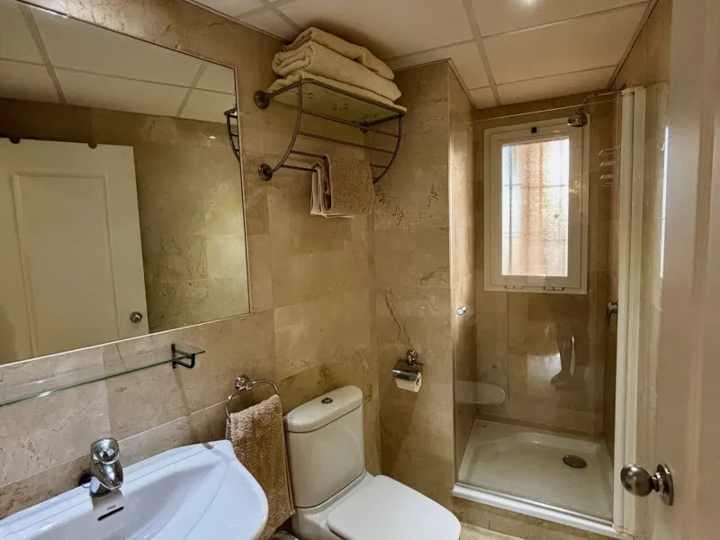 Discover this elegant 2-bedroom, 2-bathroom ground-floor apartment located in the sought-after Milenio complex in Miraflores, perfectly positioned front line to the golf course. This charming home combines comfort, style, and resort-like amenities—ideal f
