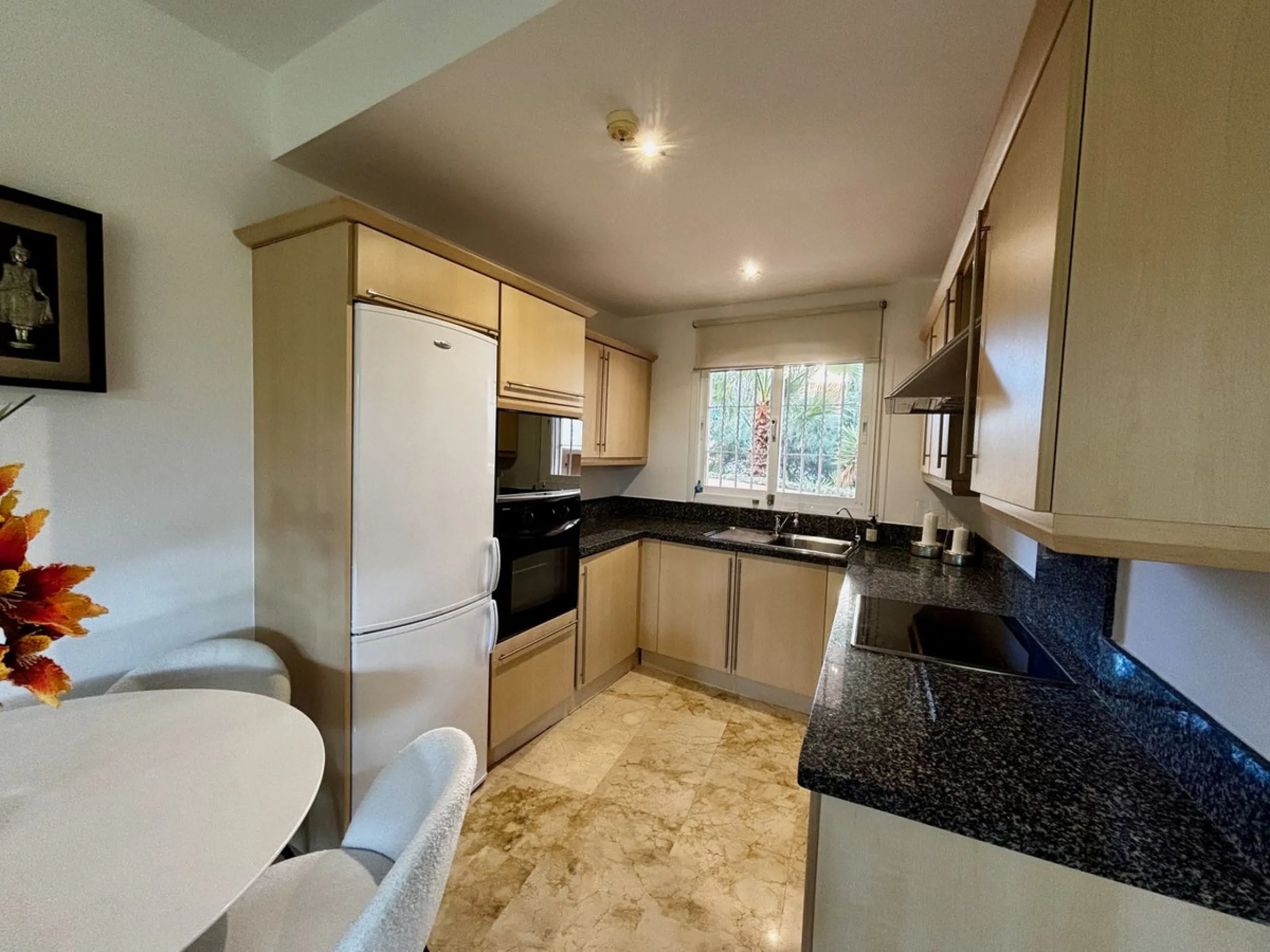 Discover this elegant 2-bedroom, 2-bathroom ground-floor apartment located in the sought-after Milenio complex in Miraflores, perfectly positioned front line to the golf course. This charming home combines comfort, style, and resort-like amenities—ideal f