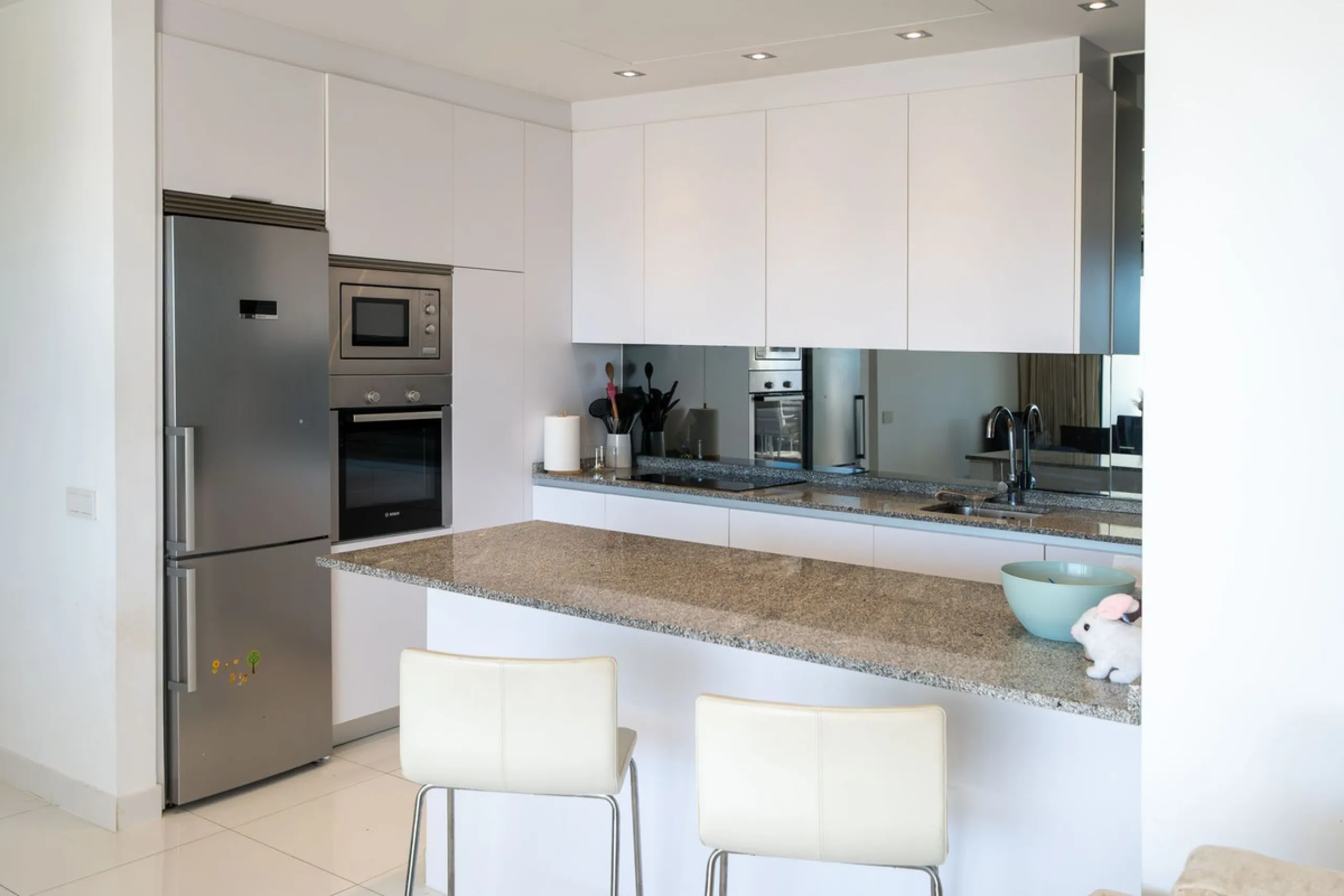 Discover the perfect blend of modern luxury and tranquility in this beautifully renovated 3-bedroom ground-floor apartment located in the prestigious Atalaya Hills. Offering breathtaking views over lush gardens, this stunning corner unit provides exceptio
