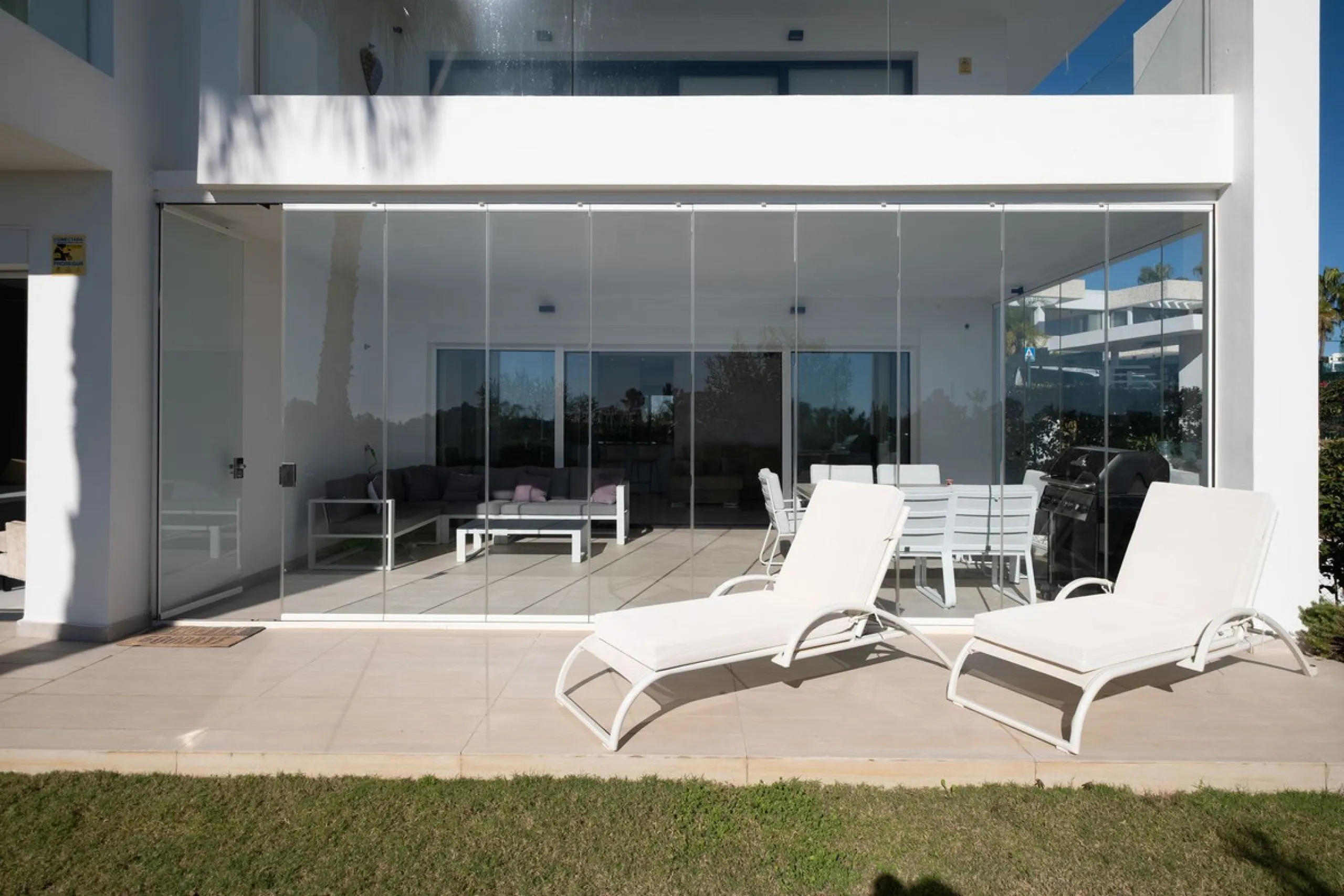 Discover the perfect blend of modern luxury and tranquility in this beautifully renovated 3-bedroom ground-floor apartment located in the prestigious Atalaya Hills. Offering breathtaking views over lush gardens, this stunning corner unit provides exceptio