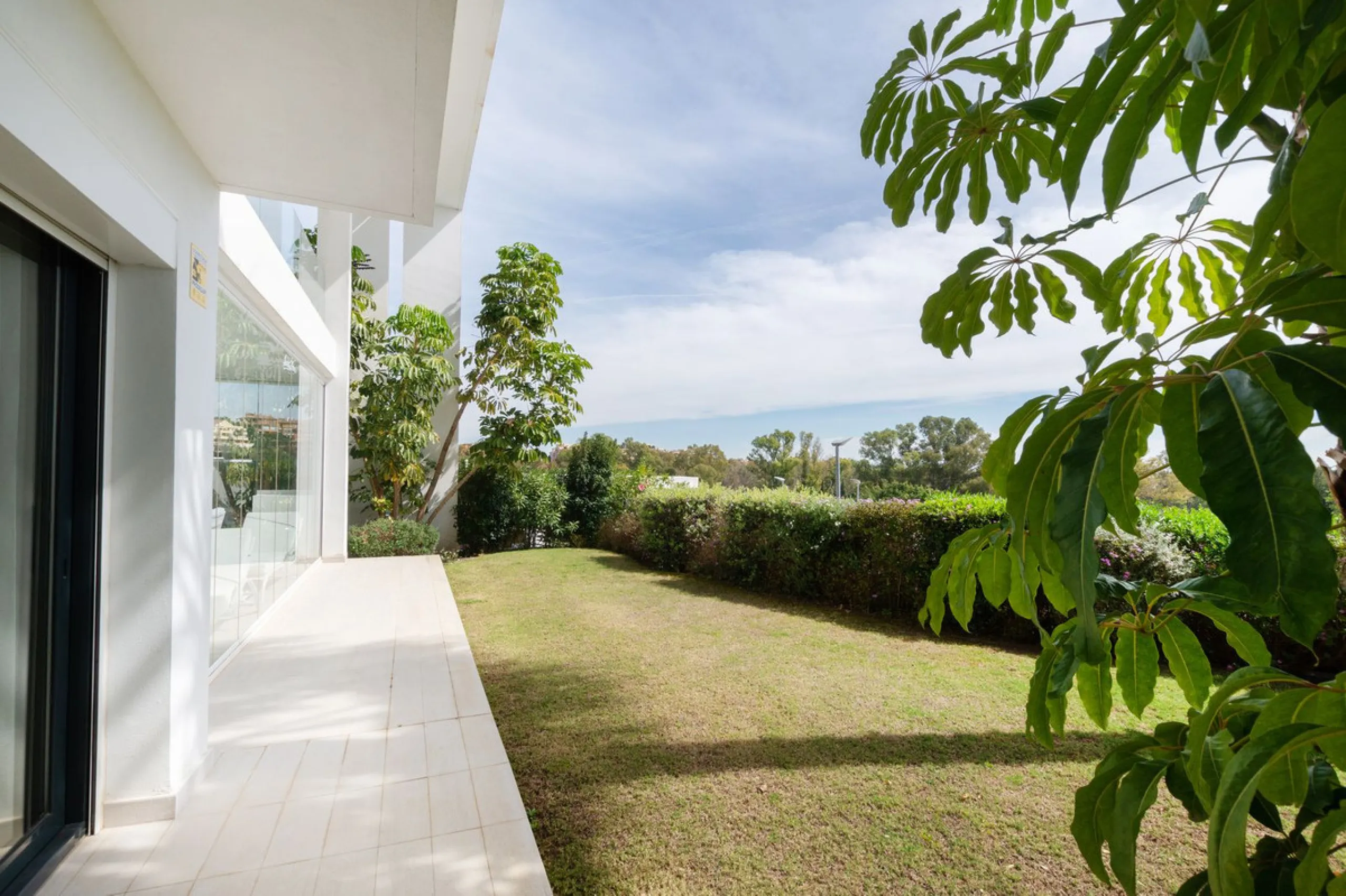 Discover the perfect blend of modern luxury and tranquility in this beautifully renovated 3-bedroom ground-floor apartment located in the prestigious Atalaya Hills. Offering breathtaking views over lush gardens, this stunning corner unit provides exceptio