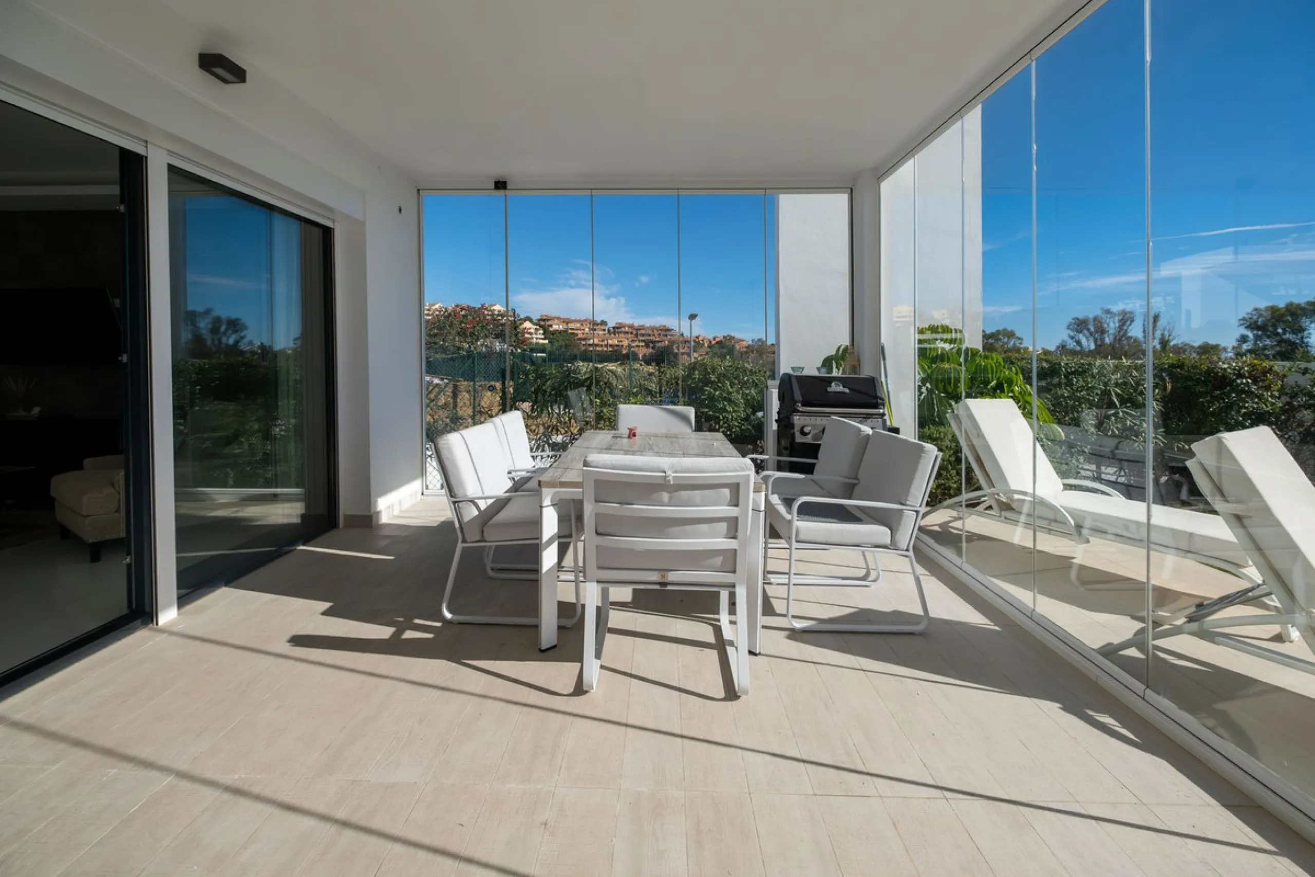 Discover the perfect blend of modern luxury and tranquility in this beautifully renovated 3-bedroom ground-floor apartment located in the prestigious Atalaya Hills. Offering breathtaking views over lush gardens, this stunning corner unit provides exceptio