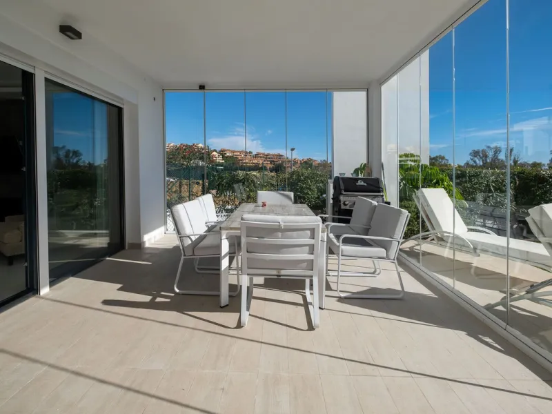 Discover the perfect blend of modern luxury and tranquility in this beautifully renovated 3-bedroom ground-floor apartment located in the prestigious Atalaya Hills. Offering breathtaking views over lush gardens, this stunning corner unit provides exceptio
