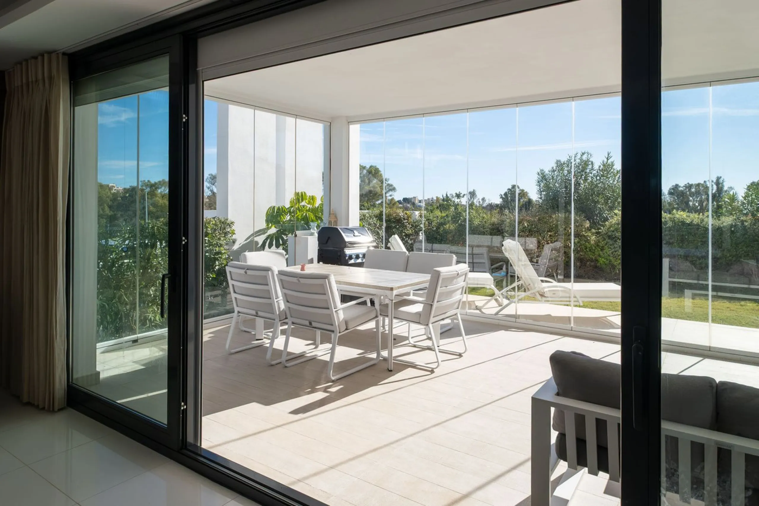 Discover the perfect blend of modern luxury and tranquility in this beautifully renovated 3-bedroom ground-floor apartment located in the prestigious Atalaya Hills. Offering breathtaking views over lush gardens, this stunning corner unit provides exceptio