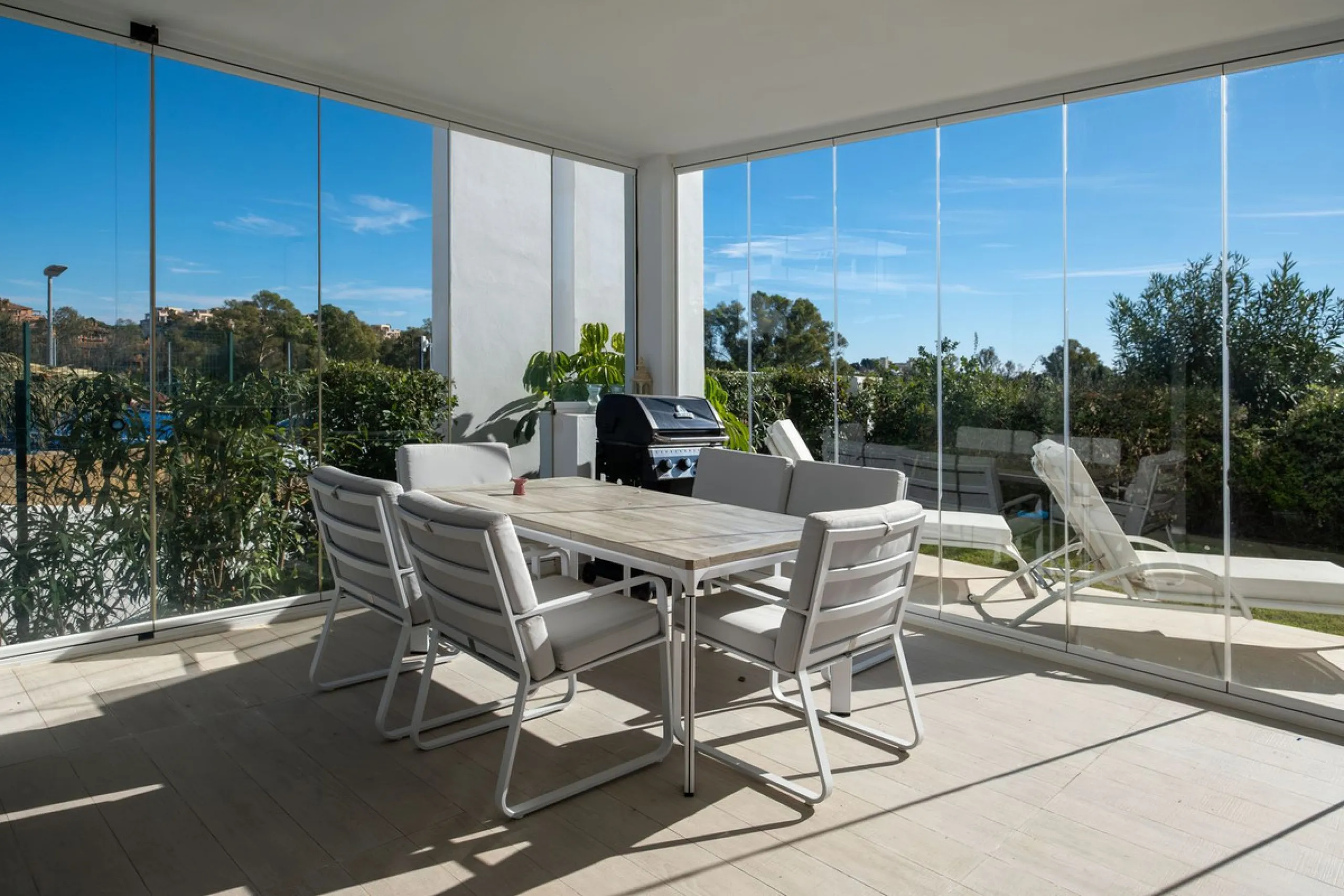 Discover the perfect blend of modern luxury and tranquility in this beautifully renovated 3-bedroom ground-floor apartment located in the prestigious Atalaya Hills. Offering breathtaking views over lush gardens, this stunning corner unit provides exceptio