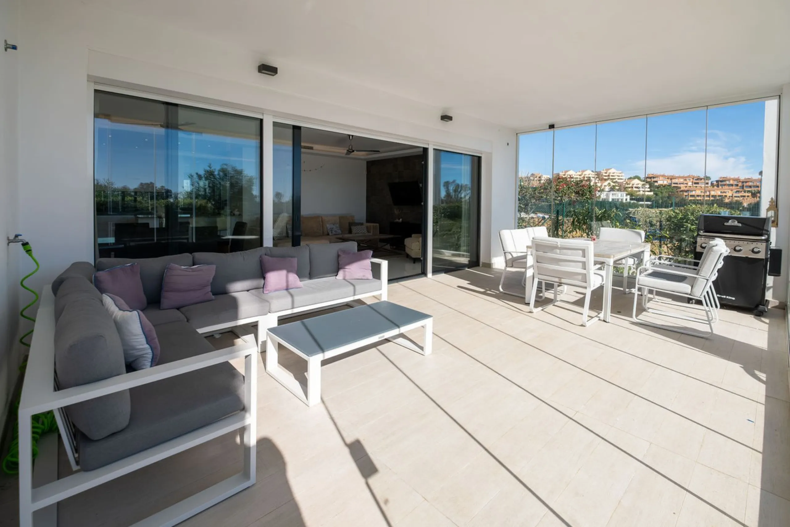 Discover the perfect blend of modern luxury and tranquility in this beautifully renovated 3-bedroom ground-floor apartment located in the prestigious Atalaya Hills. Offering breathtaking views over lush gardens, this stunning corner unit provides exceptio