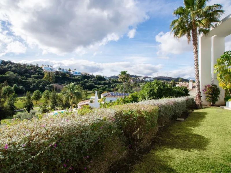 Discover the perfect blend of modern luxury and tranquility in this beautifully renovated 3-bedroom ground-floor apartment located in the prestigious Atalaya Hills. Offering breathtaking views over lush gardens, this stunning corner unit provides exceptio