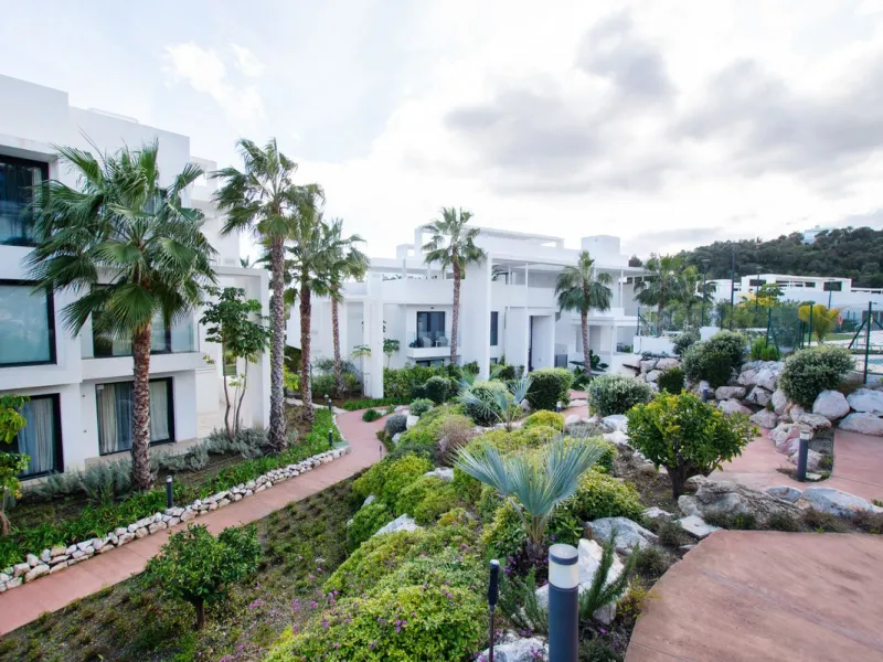 Discover the perfect blend of modern luxury and tranquility in this beautifully renovated 3-bedroom ground-floor apartment located in the prestigious Atalaya Hills. Offering breathtaking views over lush gardens, this stunning corner unit provides exceptio