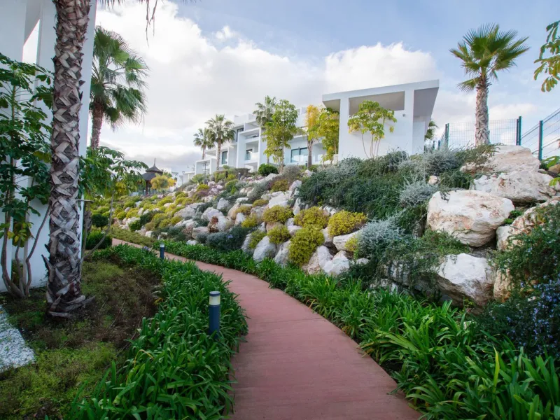 Discover the perfect blend of modern luxury and tranquility in this beautifully renovated 3-bedroom ground-floor apartment located in the prestigious Atalaya Hills. Offering breathtaking views over lush gardens, this stunning corner unit provides exceptio