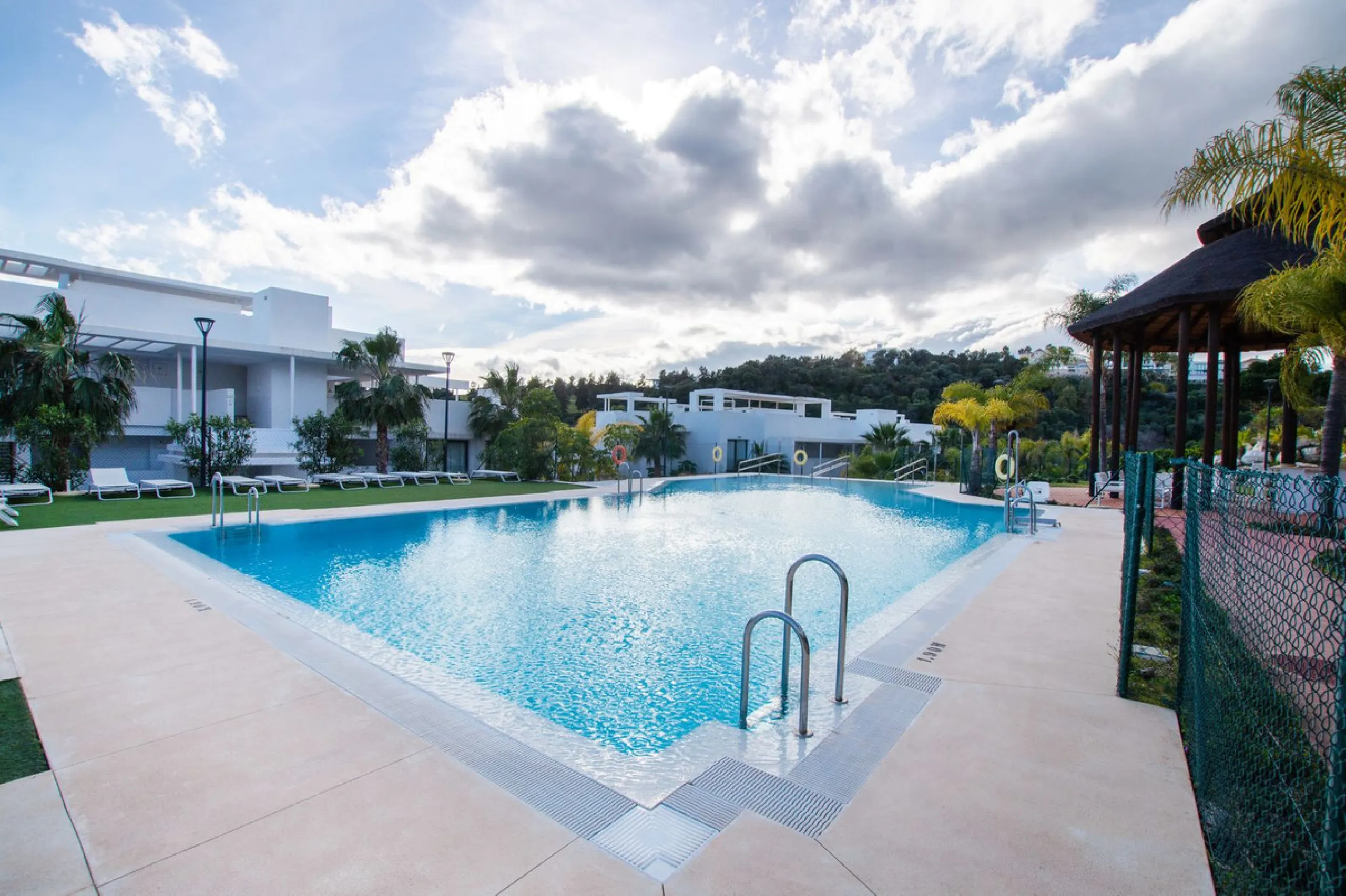 Discover the perfect blend of modern luxury and tranquility in this beautifully renovated 3-bedroom ground-floor apartment located in the prestigious Atalaya Hills. Offering breathtaking views over lush gardens, this stunning corner unit provides exceptio
