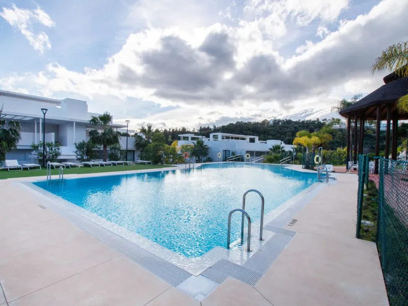 Discover the perfect blend of modern luxury and tranquility in this beautifully renovated 3-bedroom ground-floor apartment located in the prestigious Atalaya Hills. Offering breathtaking views over lush gardens, this stunning corner unit provides exceptio