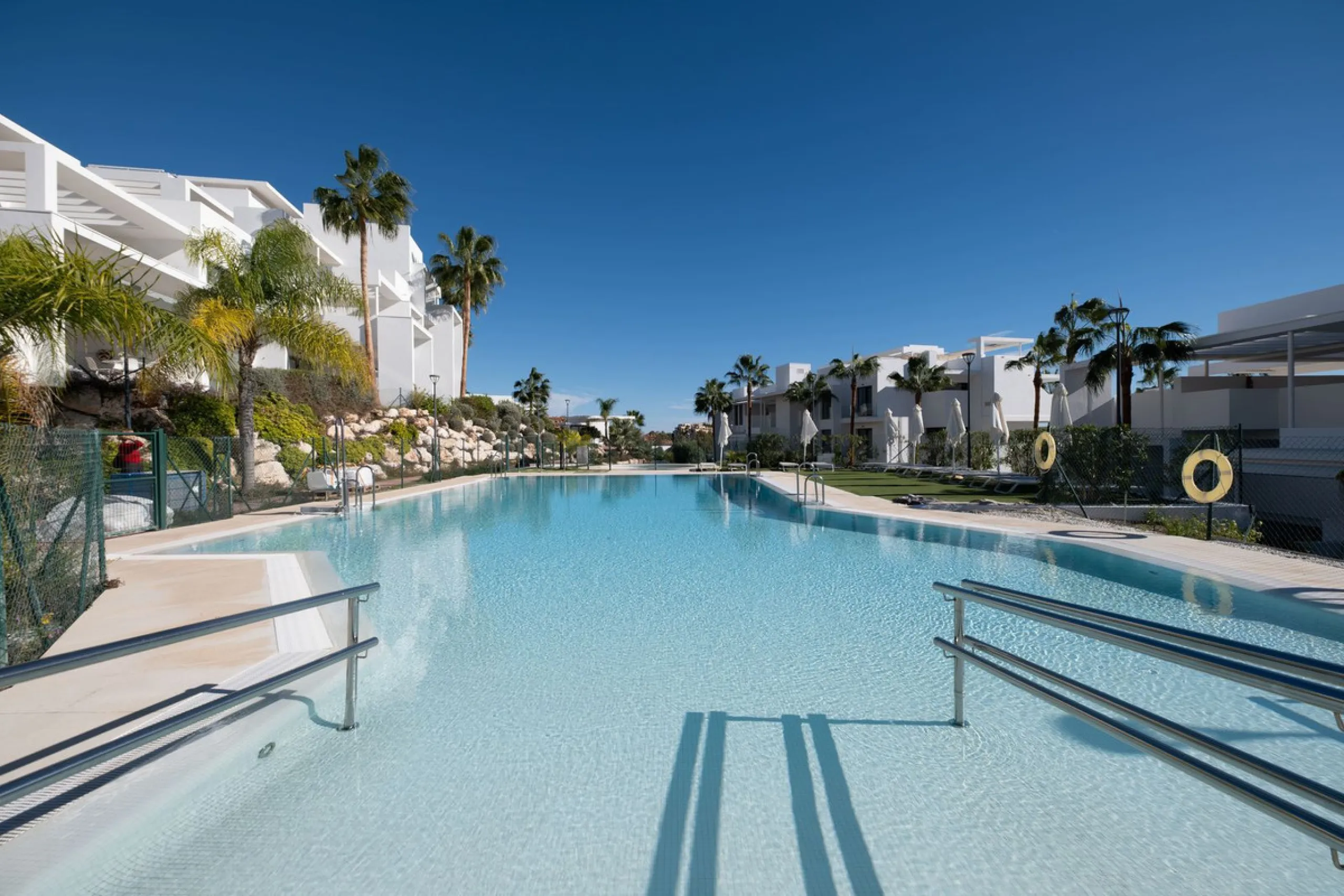 Discover the perfect blend of modern luxury and tranquility in this beautifully renovated 3-bedroom ground-floor apartment located in the prestigious Atalaya Hills. Offering breathtaking views over lush gardens, this stunning corner unit provides exceptio