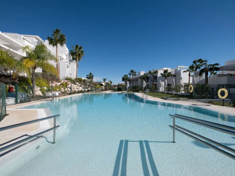 Discover the perfect blend of modern luxury and tranquility in this beautifully renovated 3-bedroom ground-floor apartment located in the prestigious Atalaya Hills. Offering breathtaking views over lush gardens, this stunning corner unit provides exceptio