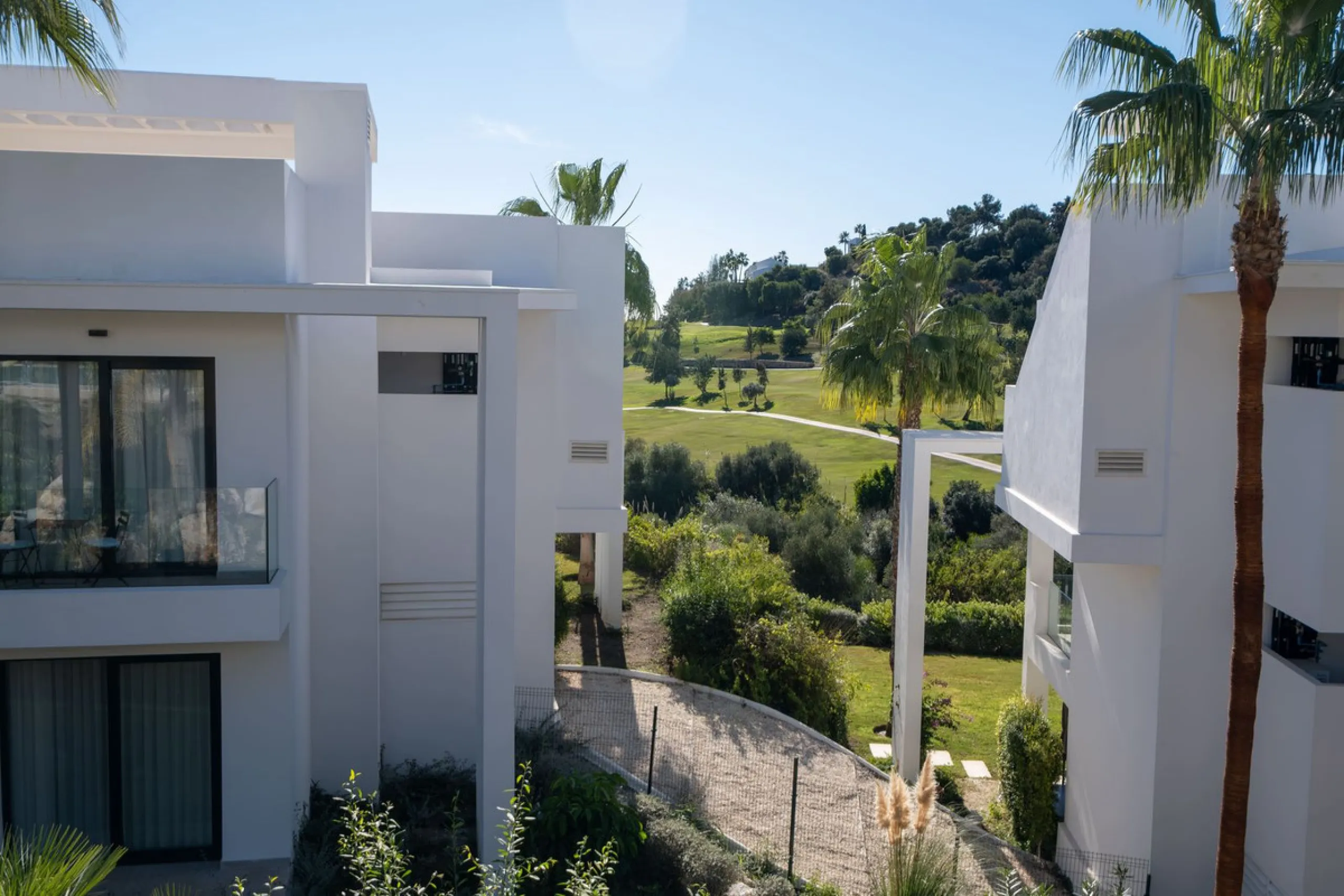 Discover the perfect blend of modern luxury and tranquility in this beautifully renovated 3-bedroom ground-floor apartment located in the prestigious Atalaya Hills. Offering breathtaking views over lush gardens, this stunning corner unit provides exceptio
