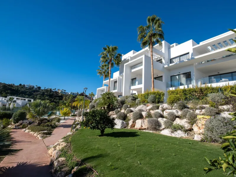 Discover the perfect blend of modern luxury and tranquility in this beautifully renovated 3-bedroom ground-floor apartment located in the prestigious Atalaya Hills. Offering breathtaking views over lush gardens, this stunning corner unit provides exceptio