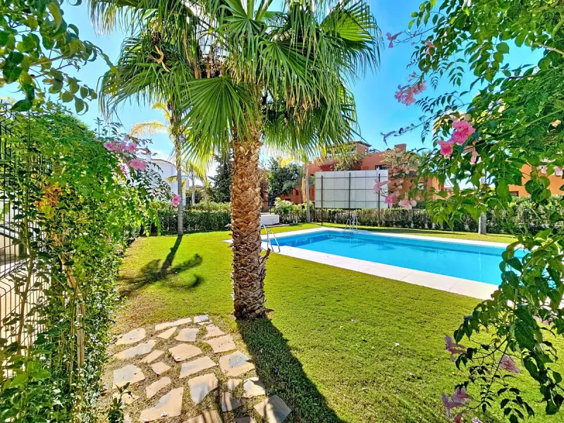 Welcome to this well-maintained two-bedroom, two-bathroom apartment set within the quiet and secure Casares Golf & Country Club, just minutes from the beach and the renowned Finca Cortesín resort.
