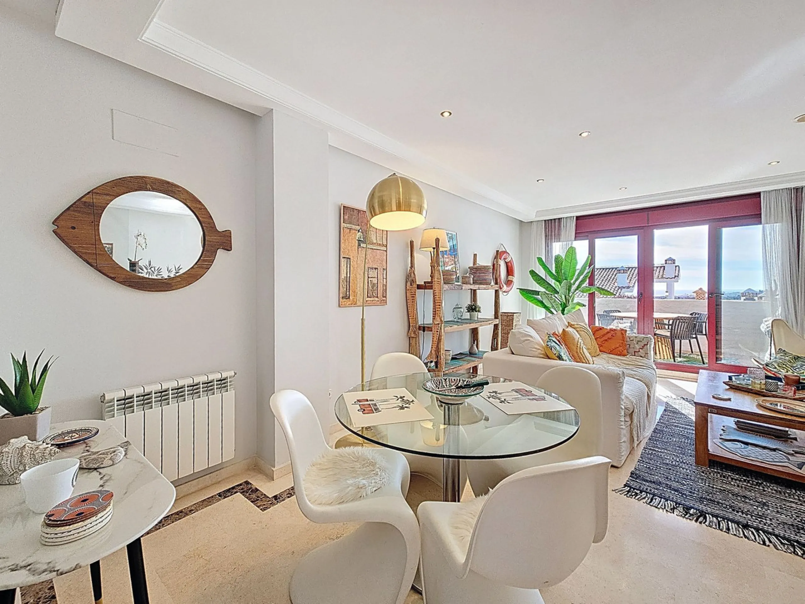 Welcome to this well-maintained two-bedroom, two-bathroom apartment set within the quiet and secure Casares Golf & Country Club, just minutes from the beach and the renowned Finca Cortesín resort.