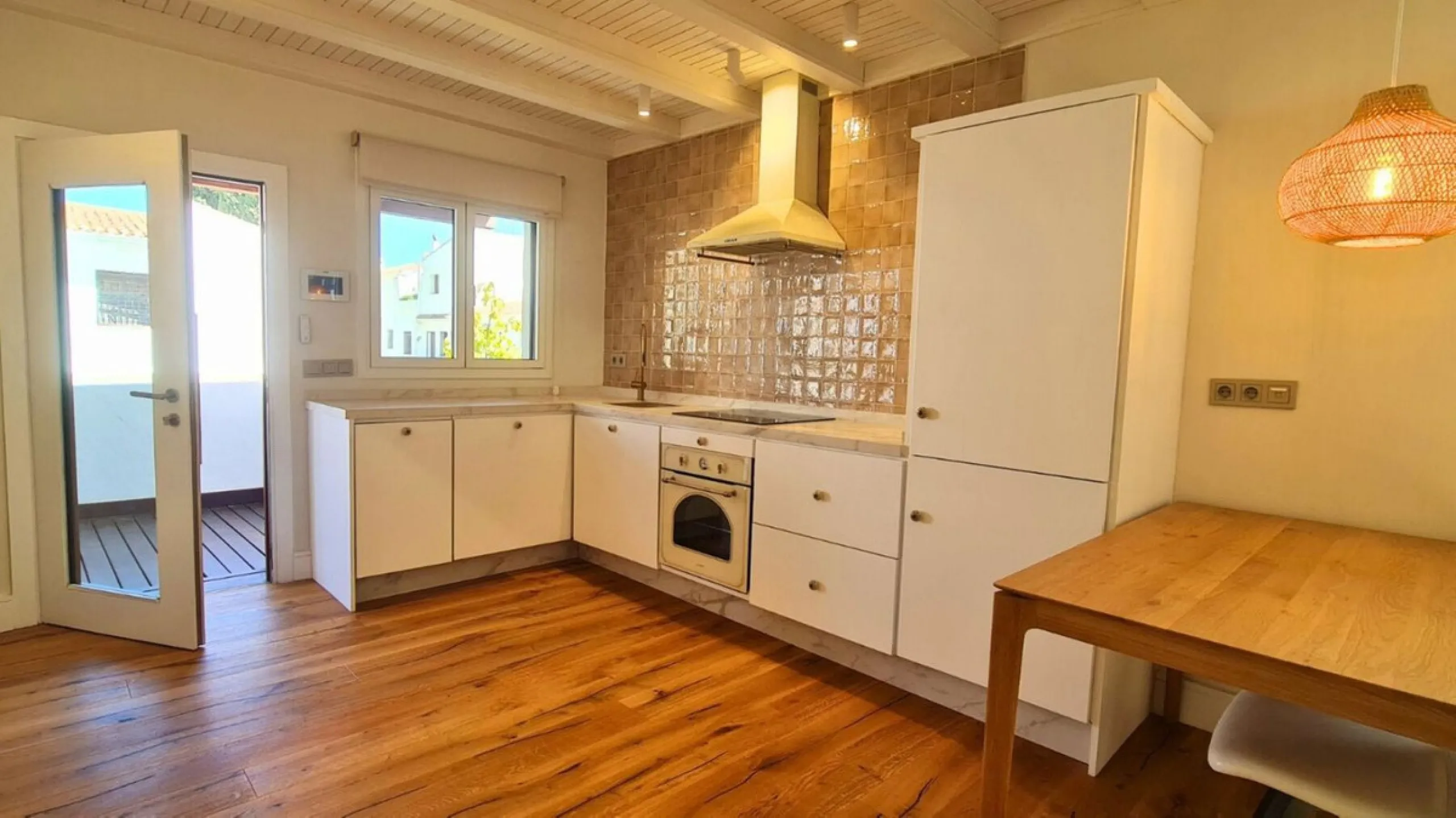 For sale is a charming, fully renovated townhouse in 2024, located in a quiet Andalusian-style village development in Marbella. This property, perfect for a small family, vacation rental, or long-term lease, features a living room with sea and garden view