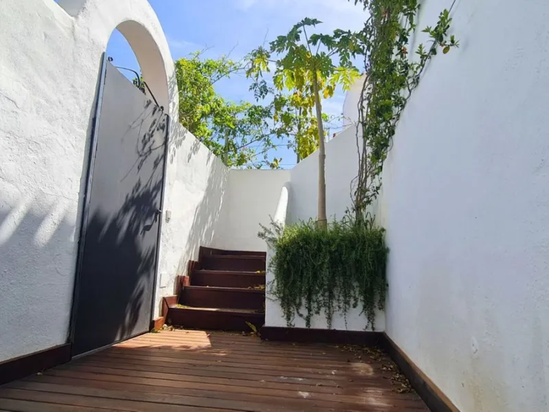 For sale is a charming, fully renovated townhouse in 2024, located in a quiet Andalusian-style village development in Marbella. This property, perfect for a small family, vacation rental, or long-term lease, features a living room with sea and garden view