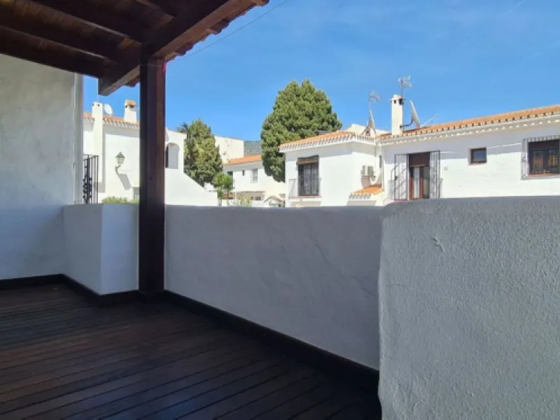 For sale is a charming, fully renovated townhouse in 2024, located in a quiet Andalusian-style village development in Marbella. This property, perfect for a small family, vacation rental, or long-term lease, features a living room with sea and garden view