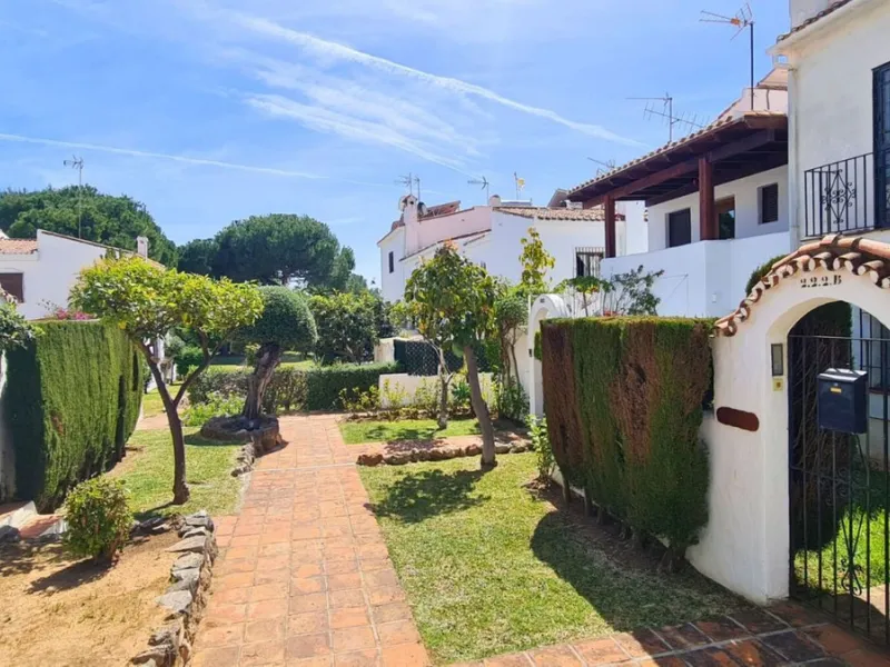 For sale is a charming, fully renovated townhouse in 2024, located in a quiet Andalusian-style village development in Marbella. This property, perfect for a small family, vacation rental, or long-term lease, features a living room with sea and garden view