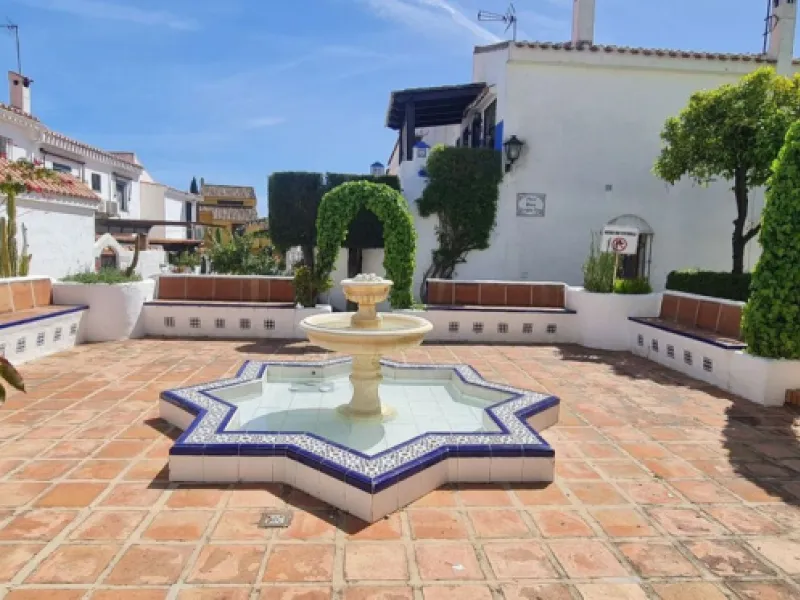 For sale is a charming, fully renovated townhouse in 2024, located in a quiet Andalusian-style village development in Marbella. This property, perfect for a small family, vacation rental, or long-term lease, features a living room with sea and garden view