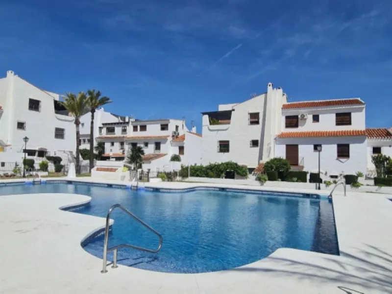 For sale is a charming, fully renovated townhouse in 2024, located in a quiet Andalusian-style village development in Marbella. This property, perfect for a small family, vacation rental, or long-term lease, features a living room with sea and garden view