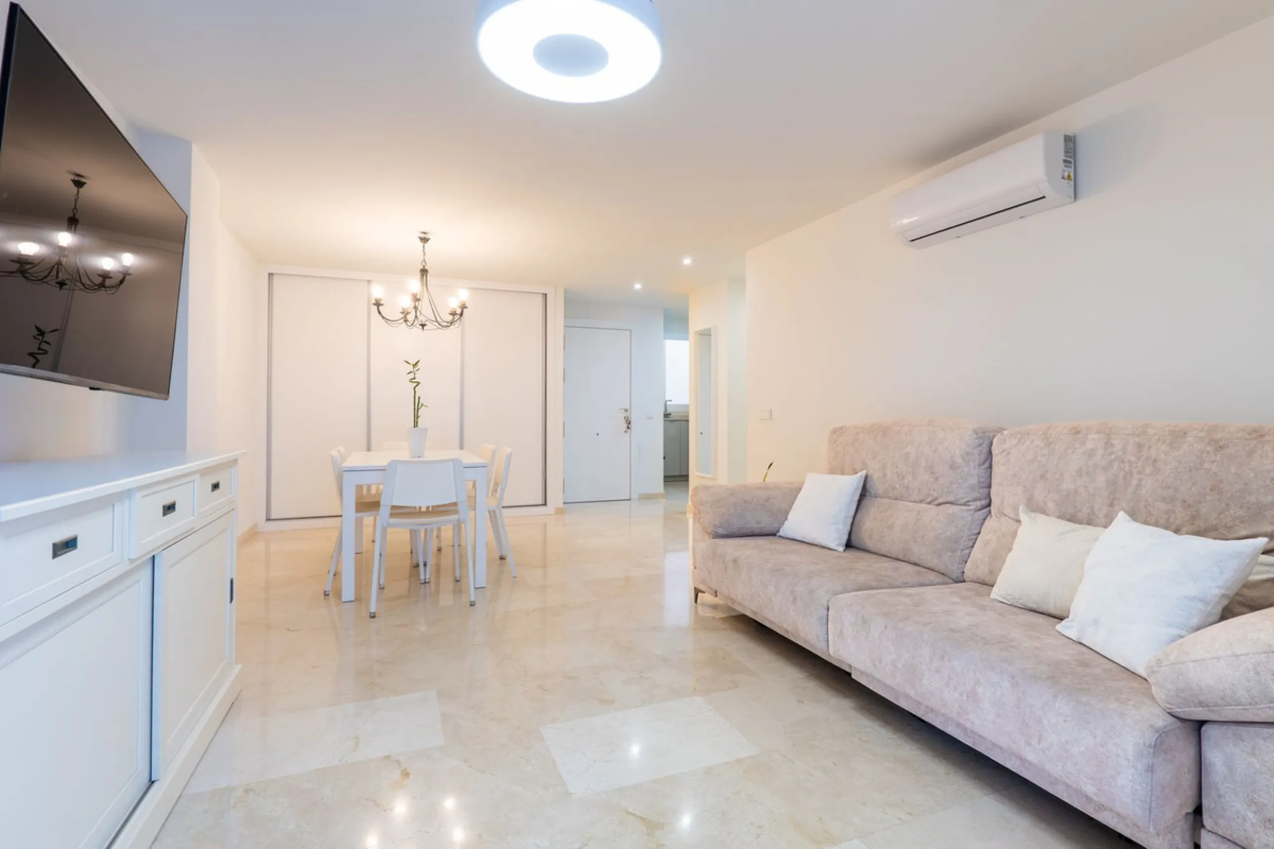 This modern and spacious apartment has been fully renovated, offering a fresh and functional design ideal for year-round living or as a smart investment opportunity. The property features a bright and generous living-dining area with direct access to a pr