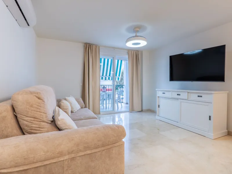 This modern and spacious apartment has been fully renovated, offering a fresh and functional design ideal for year-round living or as a smart investment opportunity. The property features a bright and generous living-dining area with direct access to a pr