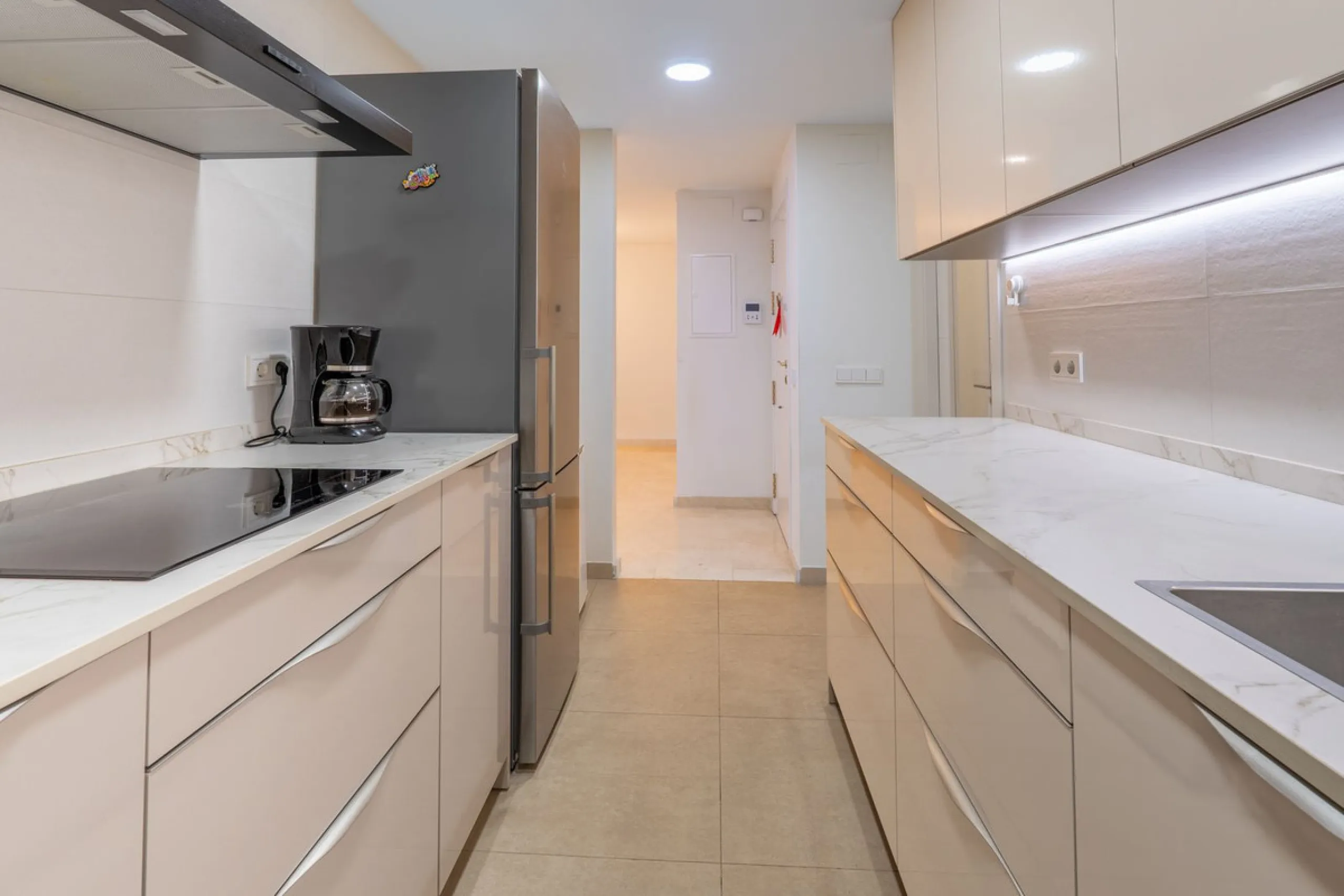This modern and spacious apartment has been fully renovated, offering a fresh and functional design ideal for year-round living or as a smart investment opportunity. The property features a bright and generous living-dining area with direct access to a pr