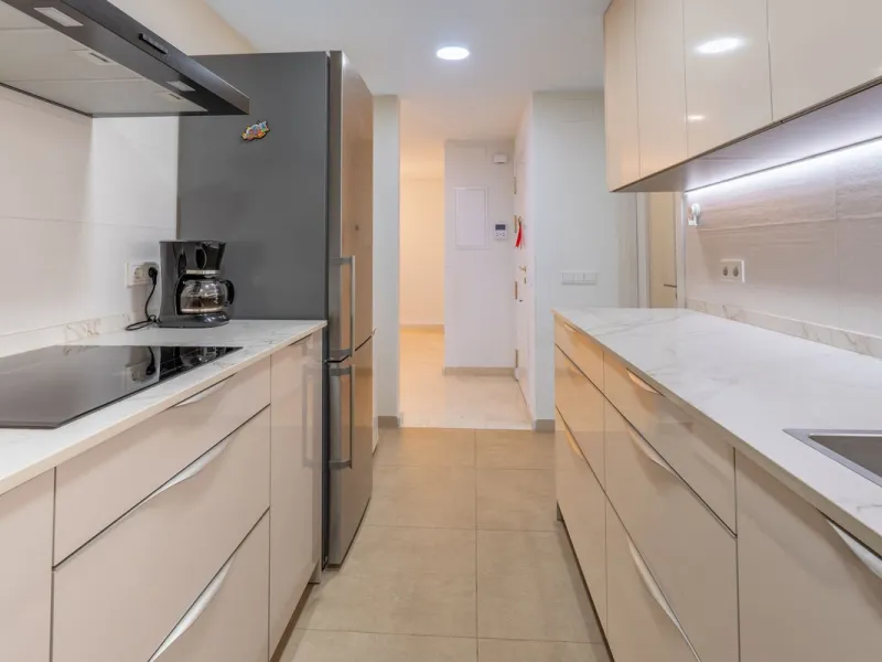 This modern and spacious apartment has been fully renovated, offering a fresh and functional design ideal for year-round living or as a smart investment opportunity. The property features a bright and generous living-dining area with direct access to a pr
