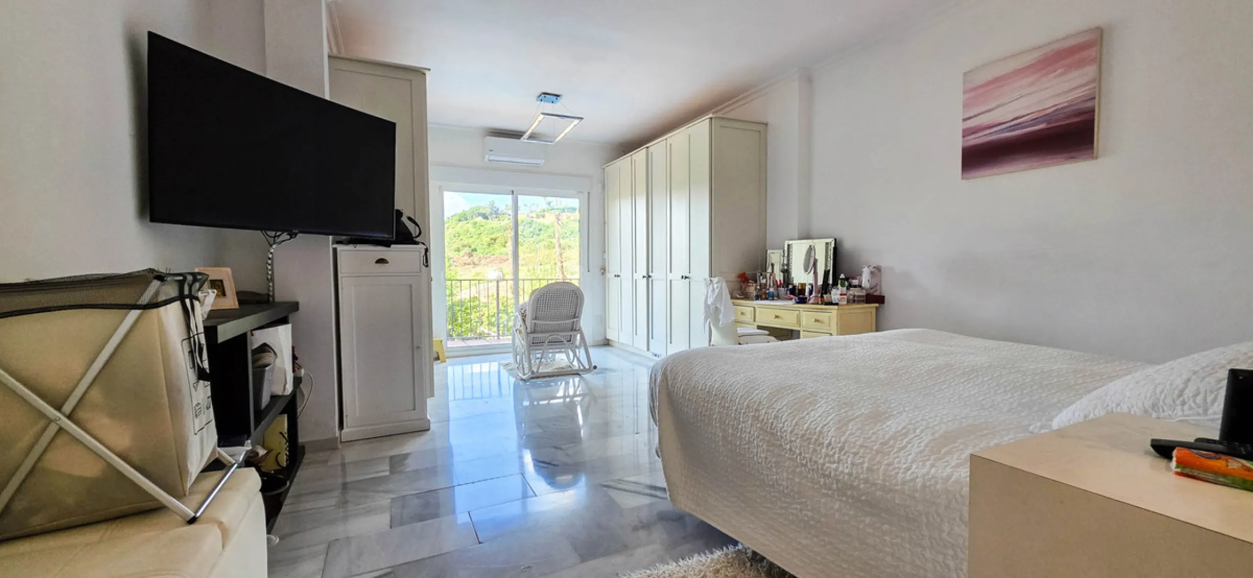 Set on the front line of La Duquesa's golf course, this south-facing semi-detached bungalow combines space, sustainability, and location in one irresistible package. Offering five bedrooms, all with ensuite bathrooms, this is a home designed for comfortab