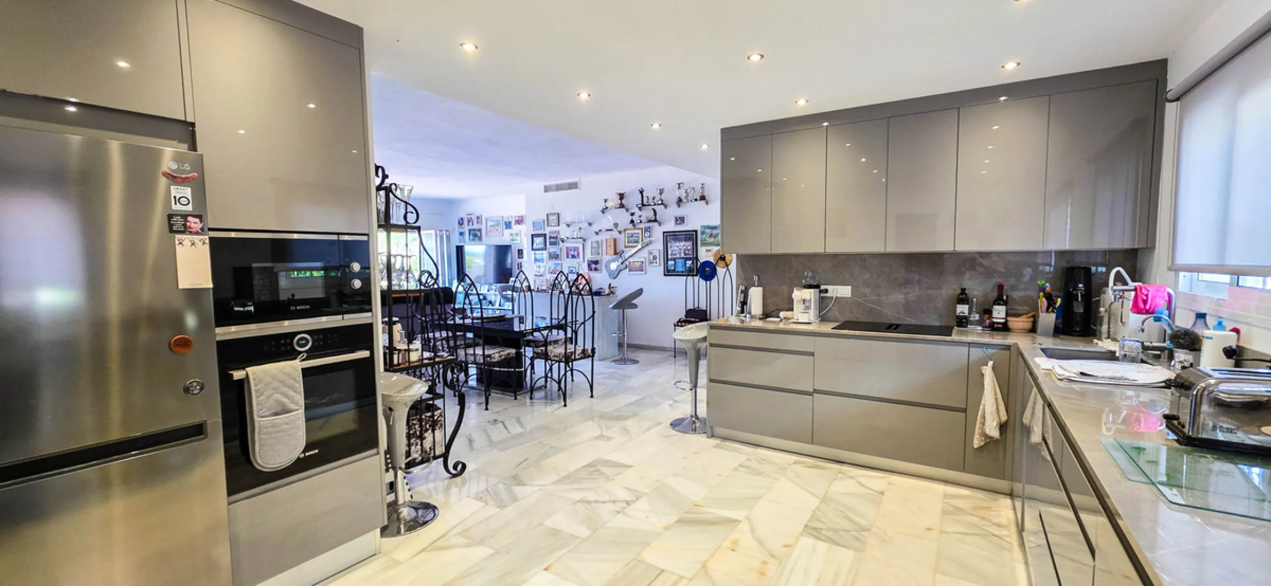 Set on the front line of La Duquesa's golf course, this south-facing semi-detached bungalow combines space, sustainability, and location in one irresistible package. Offering five bedrooms, all with ensuite bathrooms, this is a home designed for comfortab